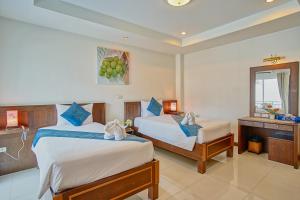 Postel nebo postele na pokoji v ubytování Ruen Buathong Boutique Hotel - SHA Certified