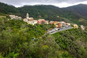 a town on a hill with a bridge and buildings at Casa Vacanze Tra Le Mura in Levanto