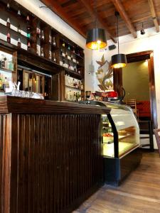 a bar with a glass counter in a restaurant at Casa Biru Hotel Boutique in Cusco