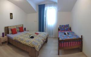 Postel nebo postele na pokoji v ubytování Apartment Onix