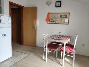 Kuchyň nebo kuchyňský kout v ubytování Apartment Onix