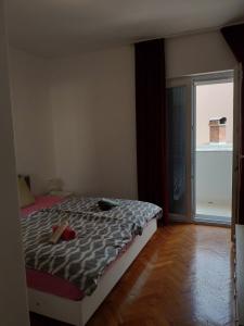 Postel nebo postele na pokoji v ubytování Apartment Onix