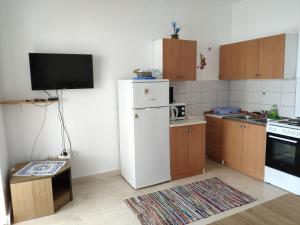 Kuchyň nebo kuchyňský kout v ubytování Apartment Onix