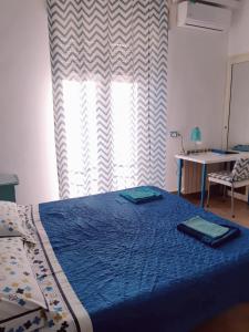 מיטה או מיטות בחדר ב-O' Paese E Masaniello