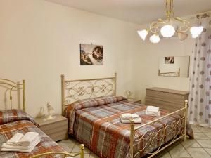Postel nebo postele na pokoji v ubytování Etna Villa Alba Chiara + 54 fotografií