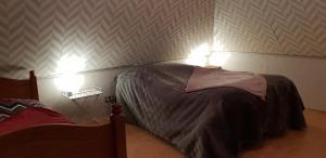 Ένα ή περισσότερα κρεβάτια σε δωμάτιο στο Le rossignol