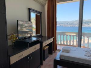 a hotel room with a view of the ocean at Hotel Dodona in Sarandë