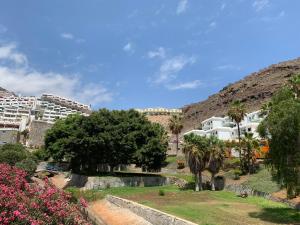 a view of a city with palm trees and buildings at Casa di Luca EL VERGEL by luca properties gran canaria in Puerto Rico de Gran Canaria