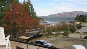 a balcony with a view of a body of water at Apart Costanera in Villa Pehuenia