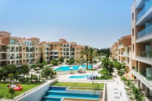 an aerial view of an apartment complex with a swimming pool at Elysia Park in Paphos