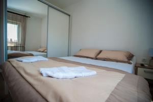 Postel nebo postele na pokoji v ubytování Guesthouse Buco
