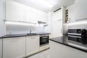 Kuchyň nebo kuchyňský kout v ubytování LAAX Homes - Runca 752 + 2 fotografie