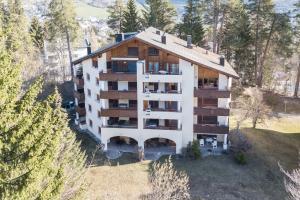 an aerial view of a building with trees at LAAX Homes - Runca 752 in Flims