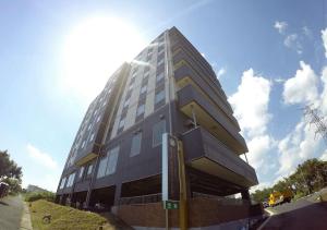 a tall building on the side of a street at Hotel Ocean Iwasawa / Vacation STAY 33555 in Kido