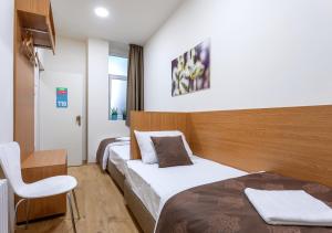 Letto o letti in una camera di Booking En Suite