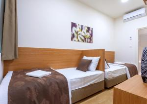 Letto o letti in una camera di Booking En Suite