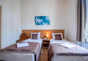 Letto o letti in una camera di Booking En Suite