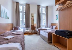 Letto o letti in una camera di Booking En Suite