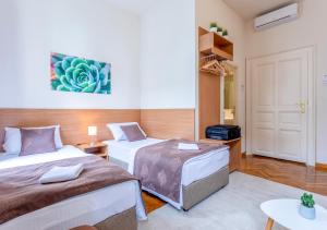 Letto o letti in una camera di Booking En Suite