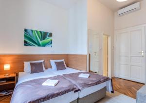 Letto o letti in una camera di Booking En Suite