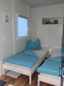 
Ein Bett oder Betten in einem Zimmer der Unterkunft Ferienwohnungen Köckhausen Nähe Red Bull Ring
