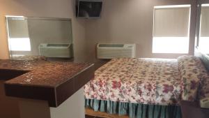 Postel nebo postele na pokoji v ubytování Royal Relax Inn
