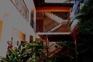 a building with stairs in the middle of a building at Hotel Charme Fonte do Boi in Salvador