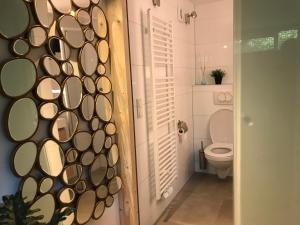 a bathroom with a toilet next to a door at 84huis in Amstelveen