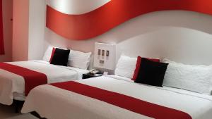 Postel nebo postele na pokoji v ubytování Hotel Dluxe