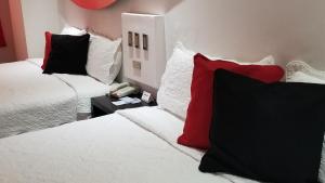 Postel nebo postele na pokoji v ubytování Hotel Dluxe