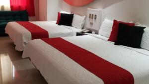 Postel nebo postele na pokoji v ubytování Hotel Dluxe