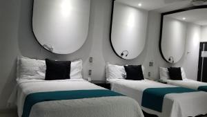 Postel nebo postele na pokoji v ubytování Hotel Dluxe