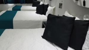 Postel nebo postele na pokoji v ubytování Hotel Dluxe
