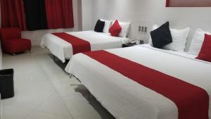 Postel nebo postele na pokoji v ubytování Hotel Dluxe