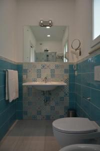 a bathroom with a sink and a toilet at Dreams Tropea Mare "Parking Private" in Tropea +153 photos