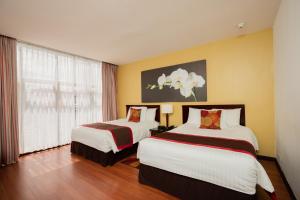 Ένα ή περισσότερα κρεβάτια σε δωμάτιο στο Hotel Palma Real