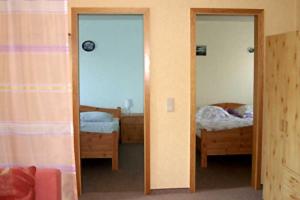 Ένα ή περισσότερα κρεβάτια σε δωμάτιο στο Ferienhaus in Plogshagenauf Hidden +14 φωτογραφίες