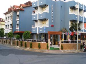 a blue building on the side of a street at Angels Inn Marmaris in Marmaris