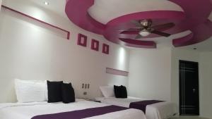 Postel nebo postele na pokoji v ubytování Hotel Dluxe
