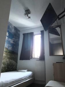 Ένα ή περισσότερα κρεβάτια σε δωμάτιο στο Hotel Velsen