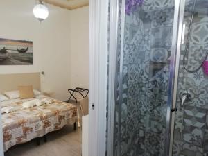 Postel nebo postele na pokoji v ubytování B&B 36 Passi dal Mare