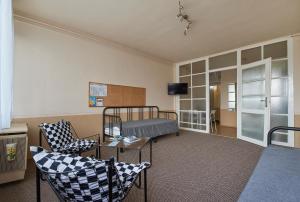 Televízia a/alebo spoločenská miestnosť v ubytovaní LEM Suburban Apartment