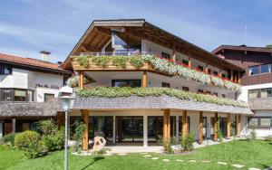 a building with plants on the side of it at Haus Panorama in Schliersee