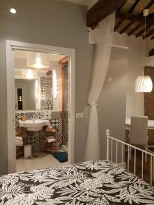 En eller flere senge i et værelse på La Casa nel Castello