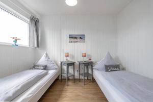 Ліжко або ліжка в номері Schwimmendes Haus Sea Breeze