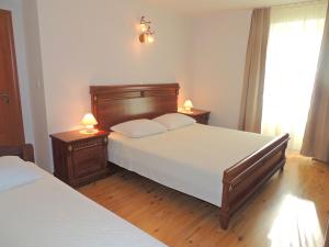 Ένα ή περισσότερα κρεβάτια σε δωμάτιο στο Apartments Ivan D