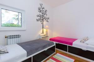 Postel nebo postele na pokoji v ubytování Villa Valica