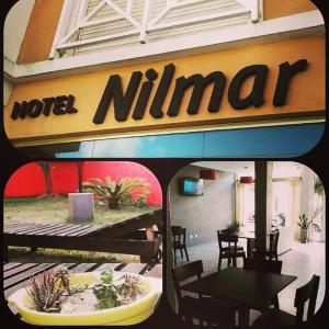 un cartello per un ristorante con tavoli e sedie di Hotel Nilmar a San Clemente del Tuyú