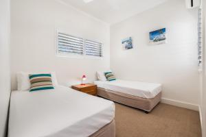Voodi või voodid majutusasutuse Mirra Chana Beachfront Apartments Mooloolaba toas