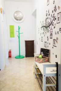 a living room with a cross on the wall at Moments Apartment in Dekani